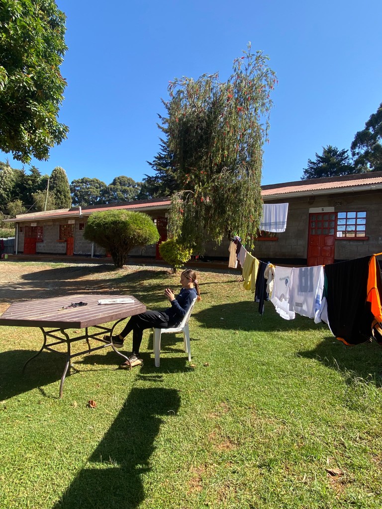 Camp rooms and a clothesline in the garden